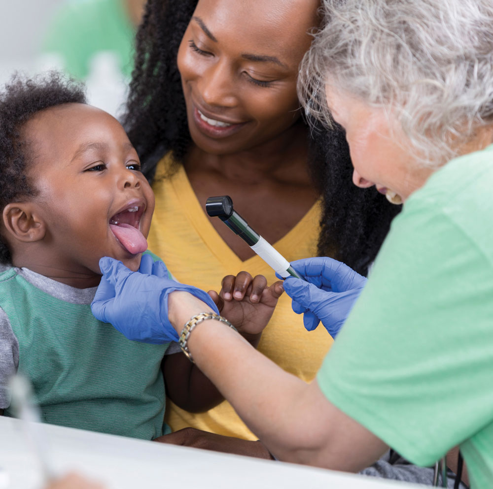 Doctor with mother and child