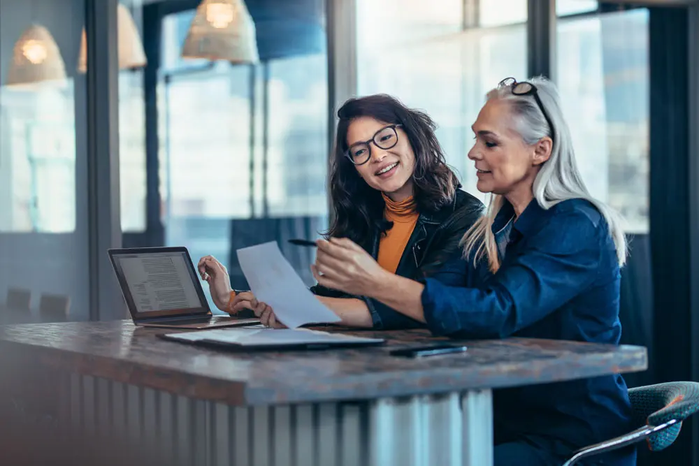 Two women working on support